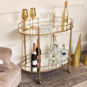 Melody Maison Gold Mirrored Oval Drinks Trolley