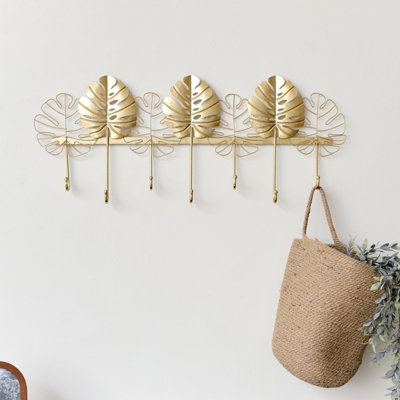 Melody Maison Large Gold Monstera Leaf Wall Mounted Hook Rail with 7 Storage Hooks