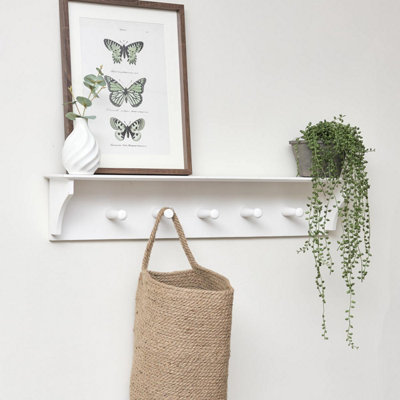 https://media.diy.com/is/image/KingfisherDigital/melody-maison-white-wall-shelf-with-hooks~5056312611385_01c_MP?$MOB_PREV$&$width=768&$height=768