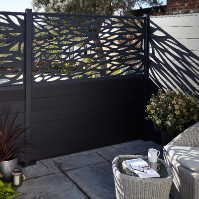 Modern garden dark grey fencing with decorative cut-out panels, adding privacy, style, and a modern touch to the outdoor space.