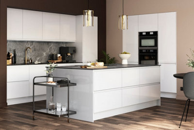 A modern white gloss kitchen island with a black trolley.
