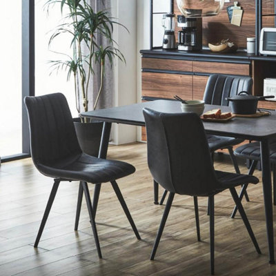 Natural wood table online with black chairs