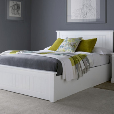 White wooden double bed store with storage