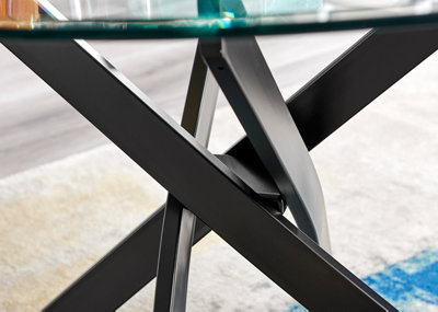 Novara 100cm 2 4 Seater Round Glass Dining Table with Black Metal Angled Starburst Legs for Modern Industrial Dining Room