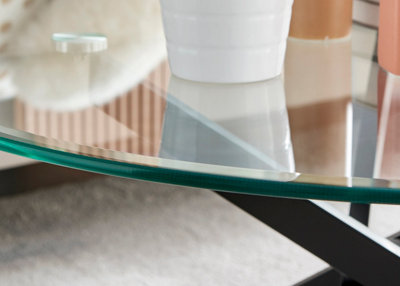 Novara Round Glass Coffee Table with Angled Starburst Black Metal Legs for Modern Industrial Minimalist Living Room