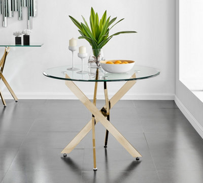 Novara Round Tempered Glass Dining Table 2 4 Seater with Angled Starburst Gold Chrome Metal Legs for Modern Glam Dining Room