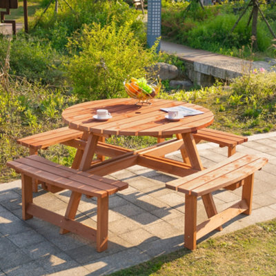 Outdoor wooden table with shop bench seats