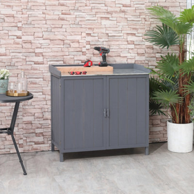 Potting table deals with cupboard