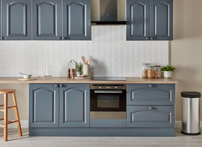Kitchen cabinets painted with a blue gloss finish, giving them a slight shine.