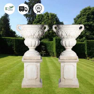 Pair of Giant Fruit design Stone Vases on Plinths
