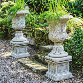 Pair of Large Victorian Stone Cast Urns with Plinths