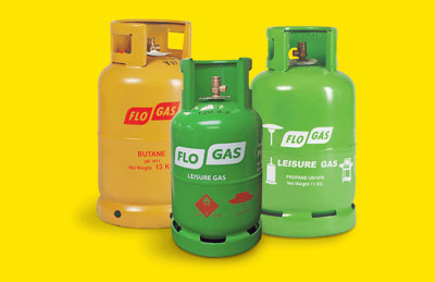 Three flogas bottles yellow Butane 13kg, green Propane 11kg and green propane 7kg