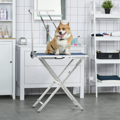 Pet grooming shop arm with clamp