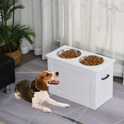 Raised dog feeding station with clearance storage