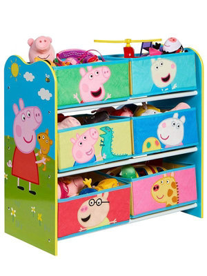 A plastic Peppa Pig toy play house standing on a table Stock Photo