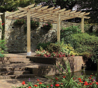 A pergola installed on a raised patio, providing an inviting spot for al fresco dining or gatherings.