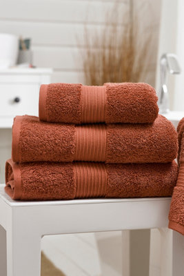 Copper colored hand outlet towels