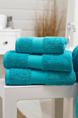 https://media.diy.com/is/image/KingfisherDigital/pima-cotton-luxury-bliss-plain-hand-towel-teal~5026446156267_01c_MP?$MOB_PREV$&$width=768&$height=768
