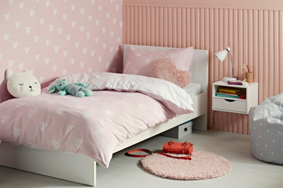 Thin pink slatted vertical wall panels in a kids bedroom.