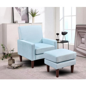 Plush velvet chair with footstool in blue