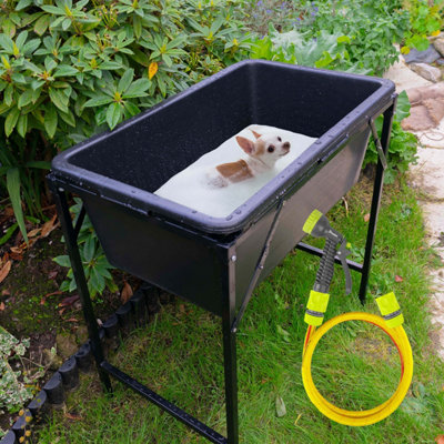 Portible dog wash bath on metal foldaway stand with drain away