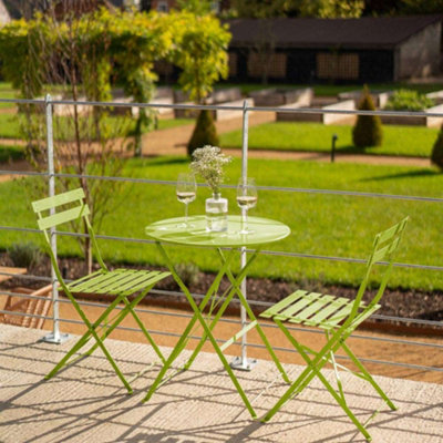 Green metal table and outlet chairs