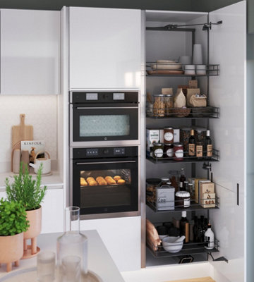Pull out larder storage in a kitchen full of food, containers and crockery.