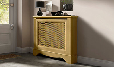 Mustard coloured traditional radiator cabinet with vent holes in the middle. Cabinet is installed in home entrance hallway.