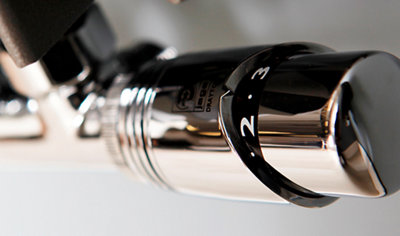 Close up of a chrome radiator valve. Valve is a thermostatic radiator valve with numbers indicating the temperature setting of the radiator.