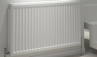 White double panel radiator with chrome angled radiator valves.