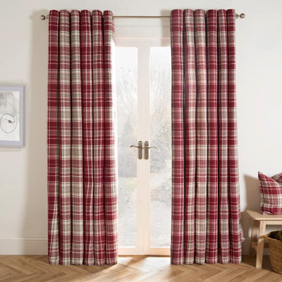 Red and white checkered curtains in a living room.