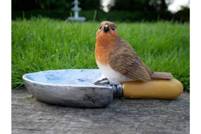 Robin sitting on Shovel bird feeder