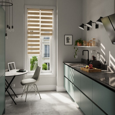Roller blinds in a modern light blue kitchen.