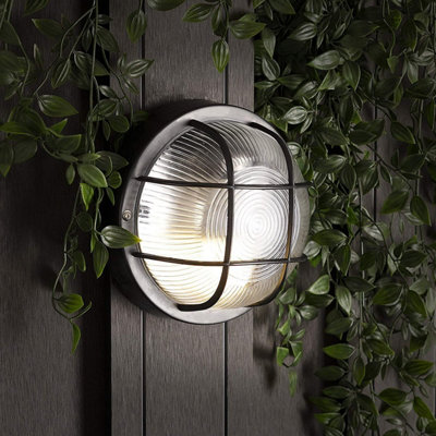 Caged bulkhead store wall light