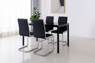 Round Glass Dining Table and 4 Grey Colour leather Chairs