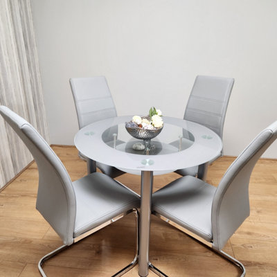 Round dining table with deals padded chairs