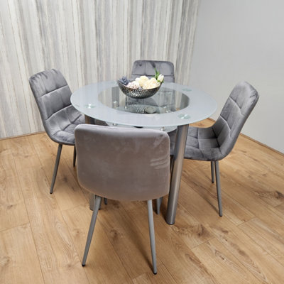 Glass dining table with four deals chairs