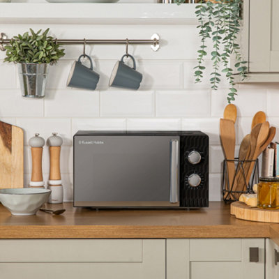 https://media.diy.com/is/image/KingfisherDigital/russell-hobbs-honeycomb-microwave-17-litre-700w-black-manual-rhmm715b~5056233801902_07c_MP?$MOB_PREV$&$width=618&$height=618