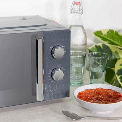 https://media.diy.com/is/image/KingfisherDigital/russell-hobbs-honeycomb-microwave-17-litre-700w-grey-manual-rhmm715g~5056233829500_05c_MP?$MOB_PREV$&$width=618&$height=618