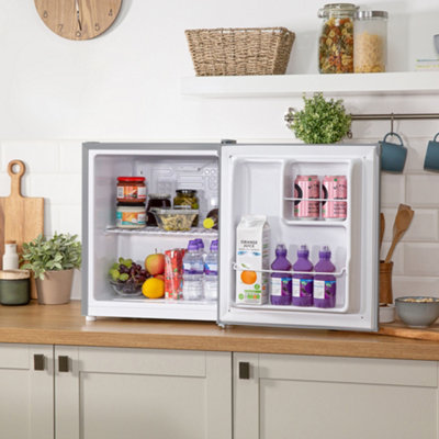 https://media.diy.com/is/image/KingfisherDigital/russell-hobbs-mini-fridge-40-litre-table-top-larder-fridge-stainless-steel-effect-rhttldr2s~5056233806020_03c_MP?$MOB_PREV$&$width=618&$height=618