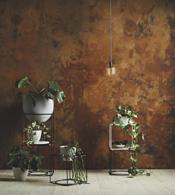 A room with rust effect painted walls, creating an industrial look reminiscent of aged metal.