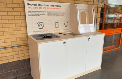 Electrical recycling unit outside a B&Q store with bins for batteries, electrical items, bulbs and tubes