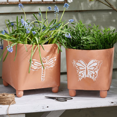 Set of 2 Embossed Butterfly Dragonfly Rustic Indoor Outdoor Garden Plant Pots Footed Terracotta Flower Planter (H)26cm, (W) 20cm