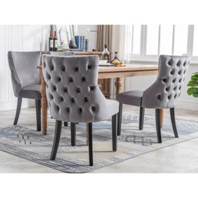 Set of 4 Velvet Upholstered Dining Chairs with Rotatable Adjustment Buttons and Nail Head Trim.