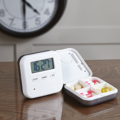 Small Pill Box with Vibrating or Audible Alarm, 4cm Screen with Countdown Timer & 4 Compartments - Measures H2 x W6.5 x D6.5cm