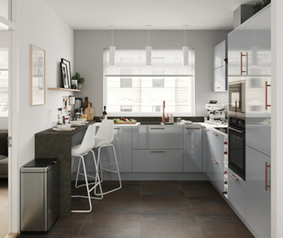 A white and dark grey kitchen with light grey cabinets, light grey walls, and dark wooden effect floor tiles.