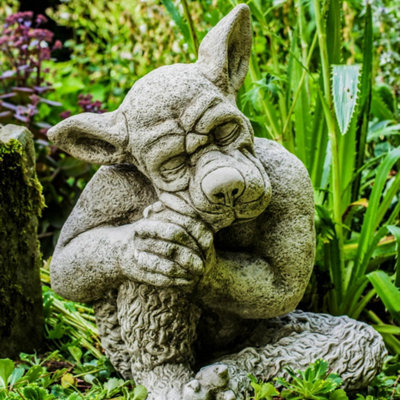 Solid cast Stone Dog Gargoyle In Sleepy Pose