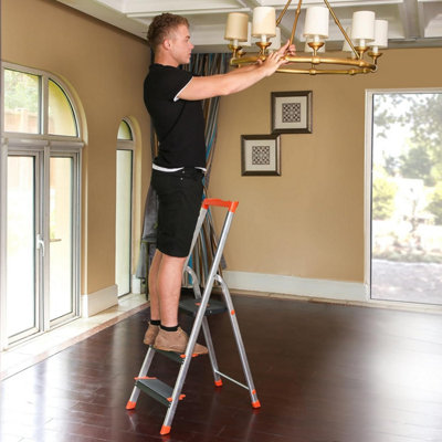 SONGMICS 3-Step Folding Ladder with Tool Tray, Featuring Anti-Slip Feet and Wide Steps, Ideal for Indoor Tasks, Black and Orange