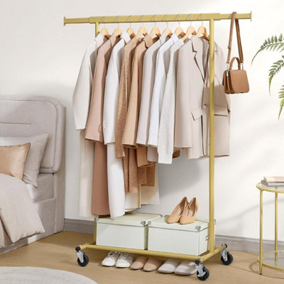SONGMICS Mobile Garment Display, Premium Wheeled Clothing Stand with Expandable Bar, Professional Grade, Pale Gold