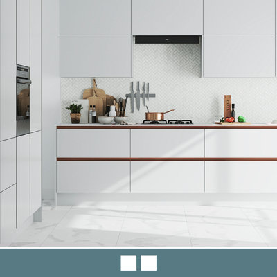 Explore the Stevia handleless gloss light grey kitchen, featuring high shine slab doors for easy cleaning.